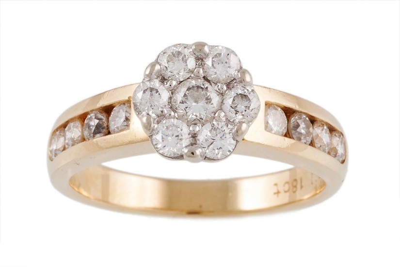 A DIAMOND DAISY CLUSTER RING, mounted in 18ct yellow gold, w...