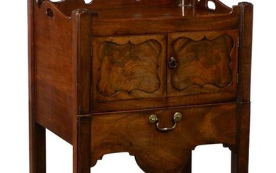 A George III mahogany tray top bedside cupboard