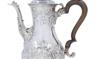 A George III silver coffee pot, London, 1783, John Kidder, of baluster form, the repousse floral scroll decorated body raised on a circular foot with bead border, the wooden scroll handle to hinged lid with urn-shaped finial, 30.2cm high, approx...