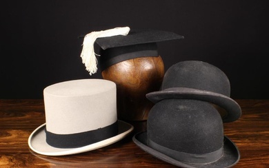 A Group of Hats. A grey felt top hat by Gieves, Old Bond Street, London, in a fitted box marked 'Loc