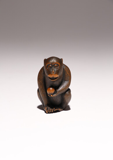 A JAPANESE WOOD CARVING OF A MONKEY