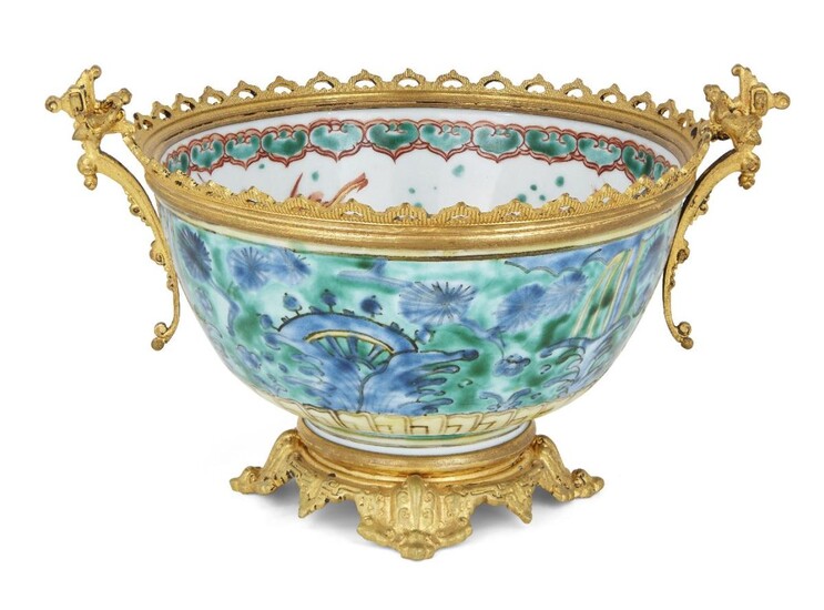 A Japanese Kutani bowl, Meiji period, mounted with later French gilt foot, rim and handles, decorated with watery flora and foliage to the exterior, fish and insects to the bowl interior, Kirin depicted in the well, signed Dai Nippon with illegible...