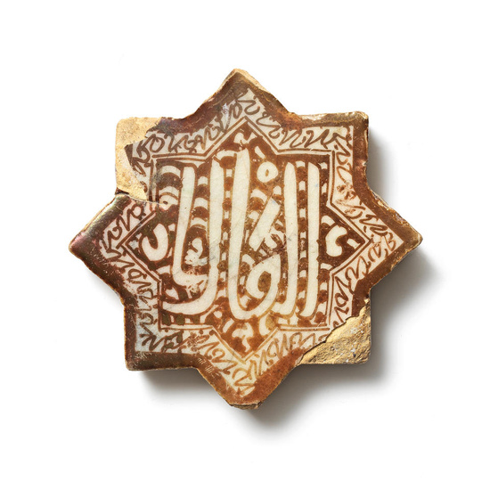 A Kashan lustre pottery star tile Persia, 12th/ 13th Century...