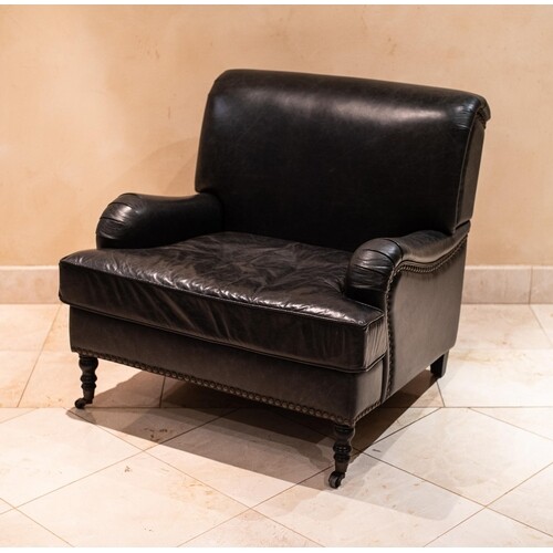 A LEATHER UPHOLSTERED LIBRARY ARMCHAIR Padded and close-nail...