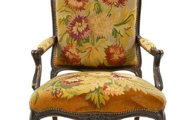 A Louis XV Style Walnut Fauteuil Height 36 inches.