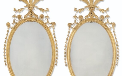 A PAIR OF GEORGE III GILTWOOD OVAL MIRRORS