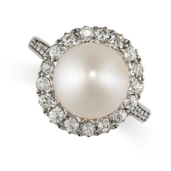 A PEARL AND DIAMOND CLUSTER RING set with a pearl of