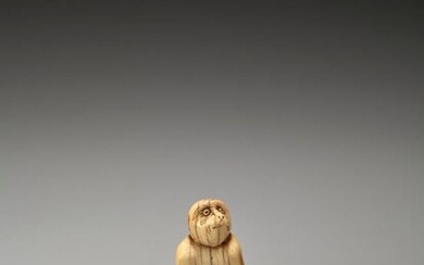 A RARE AND EARLY IVORY NETSUKE OF A MONKEY WITH YOUNG