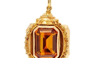 A Rose Gold and Synthetic Orange Sapphire Charm