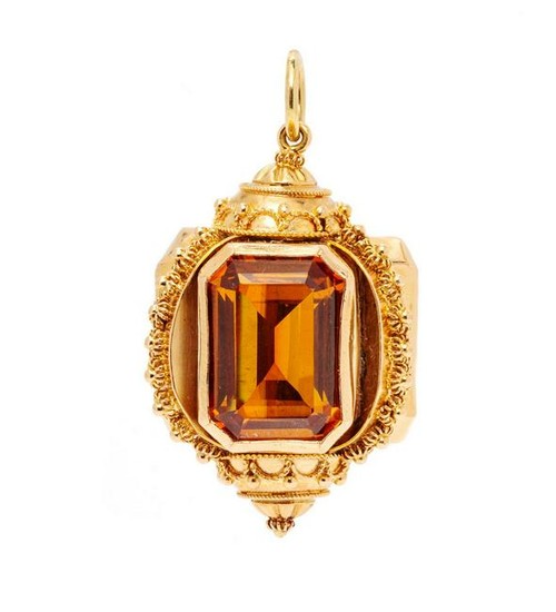 A Rose Gold and Synthetic Orange Sapphire Charm