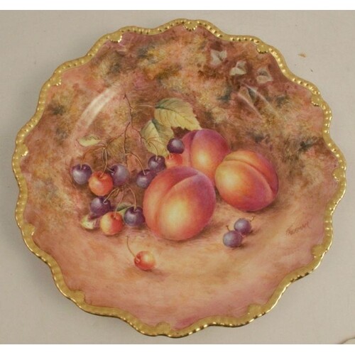 A Royal Worcester plate, with a star shaped border decorated...
