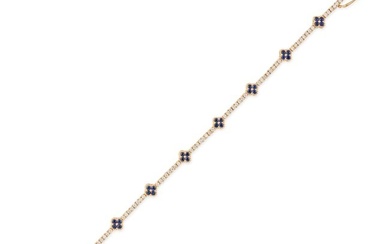 A SAPPHIRE AND DIAMOND FLOWER BRACELET comprising a row of round brilliant cut diamonds accented by