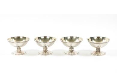 A SET OF FOUR GEORGE III SILVER OPEN SALTS of plain crested ...