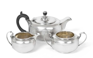 A Three-Piece Edward VII Silver Tea-Service by Holland, Aldwinckle and Slater, London, 1907