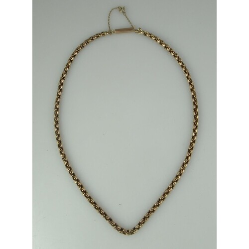 A Victorian 9ct gold chain with barrel clasp and safety chai...