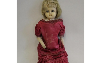 A Victorian wax shoulder head doll, with blue glass eyes, bl...