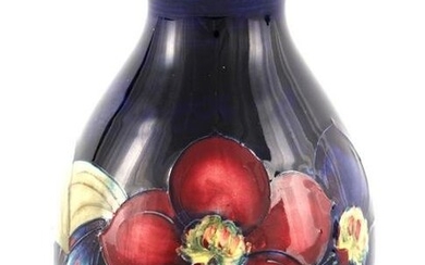 A WALTER MOORCROFT SMALL BULBOUS FOOTED VASE