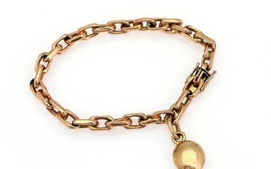 SOLD. A bracelet of 14k gold with a charm of 18k gold. Total weight app....