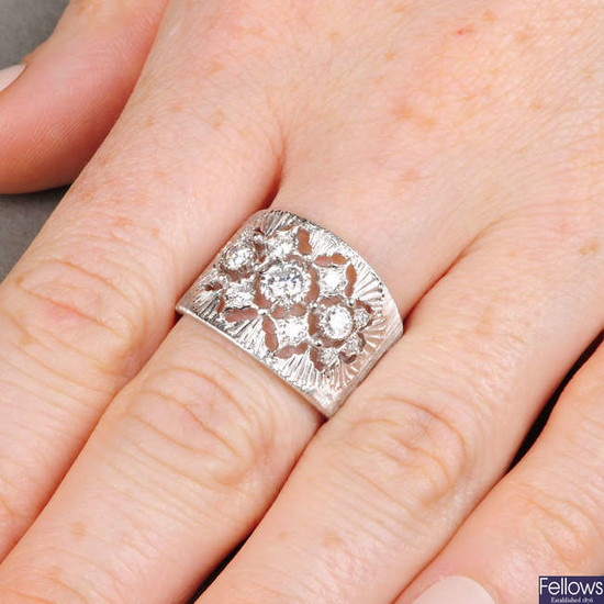 A brilliant-cut diamond openwork cluster band ring, by