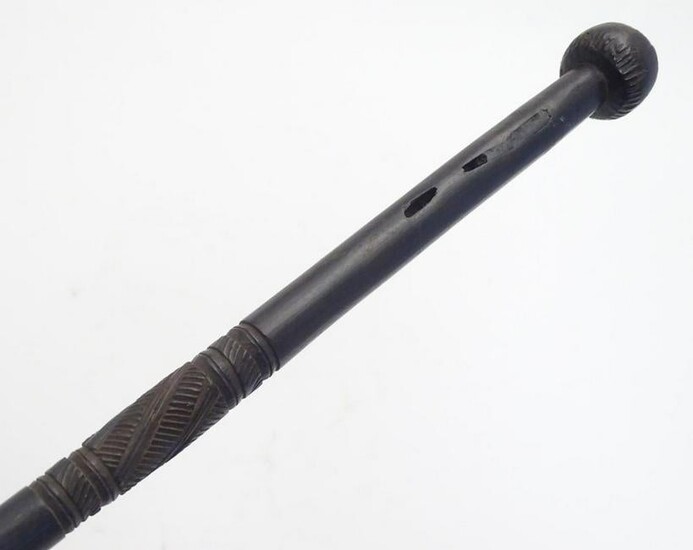 A carved hardwood tribal walking stick / cane, with a