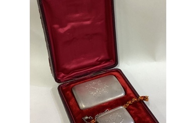 A cased Russian silver cigarette case and snuff box. Circa 1...