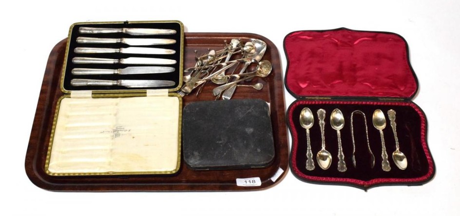 A collection of silver flatware, including: a paper knife applied...