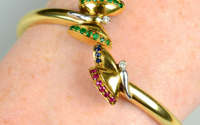 A cuff bangle, with emerald, ruby, sapphire and brilliant-cut diamond butterfly terminals.