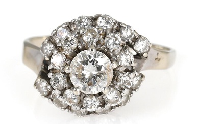 A diamond ring set with numerous brilliant-cut diamonds weighing app. 0.64 ct.,...