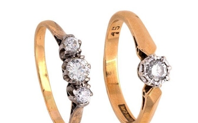 A diamond single stone ring and diamond three stone ring, set with brilliant-cut diamonds, ring size M and M 1/2