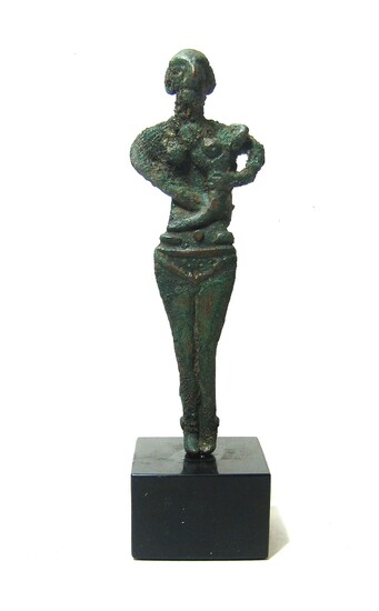 A fantastic Levantine bronze figure of a woman