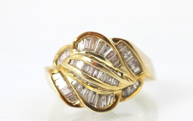 A gold coloured and diamond set dress ring, the raised head ...