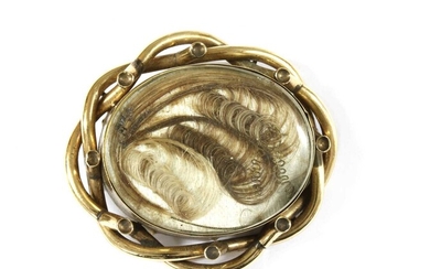 A gold mourning brooch