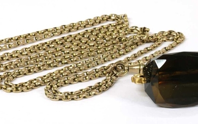 A gold oval belcher link guard chain