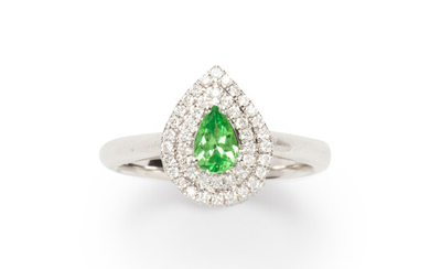 A green garnet, diamond and eighteen karat white gold ring