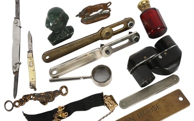 A group of interesting items, including a small carved green...