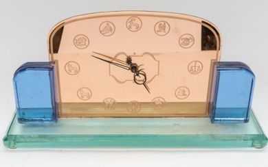 A large Art Deco glass style mantle clock with star...