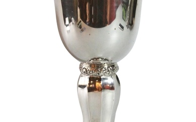 A large silver German chalice with stylized floral column. (...
