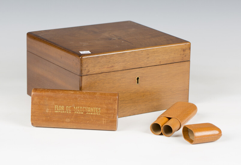 A late 20th century walnut cigar humidor, width 24cm, containing two cigar cases and various cutters