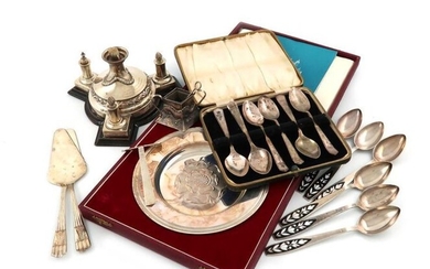 A mixed lot, comprising silver items: a Victorian table cigar lighter, by E. Hutton, London 1892, circular form, foliate border, with a central lamp, and with three lighting rods, (one later), on a wooden base, six cased teaspoons, a cased Armada dish...