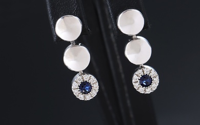 A pair of 18 kt sapphire and diamond studs. white gold, total approx. 0.49 ct. Birmingham 2004. (2)