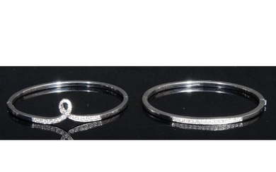 A pair of 18ct white gold diamond set hinged bangles, each p...