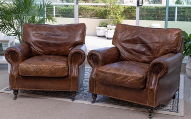 A pair of Artsome Coach house collection brown leather armchairs of generous proportions with studded detailing, with aged finish, Height 75cm x Width 90cm x Depth 80cm