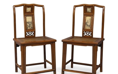 A pair of Chinese huali 'dream stone'-set chairs, 19th century, the central splat inset with two veined marble panels above a reticulated ruyi panel and above the solid seat, 92cm high. (2) 十九世紀 花梨嵌雲石椅一對