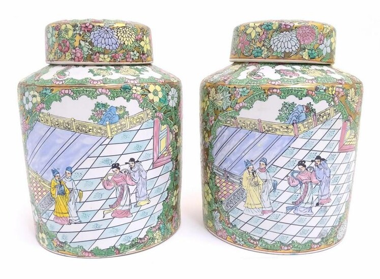 A pair of Chinese jars and covers profusely decorated