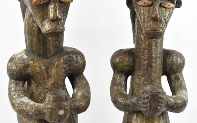 A pair of Fang, Gabon, reliquary figures set with bone...