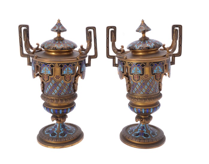 A pair of French gilt metal and champlevé enamel twin handled side or garniture urns and covers