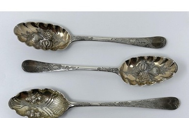 A pair of George III silver spoons, later decorated, and ano...