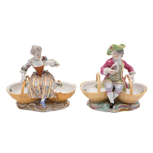 A pair of Meissen figural sweetmeat dishes and a similar pai...