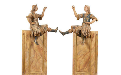 A pair of Spanish colonial polychromed wood opposing figures