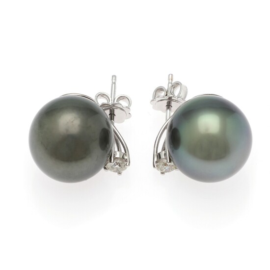 A pair of Tahiti pearl and diamond ear studs each with a cultured Tahiti pearl and a diamond weighing a total of app. 0.40 ct., mounted in 18k white gold. (2)